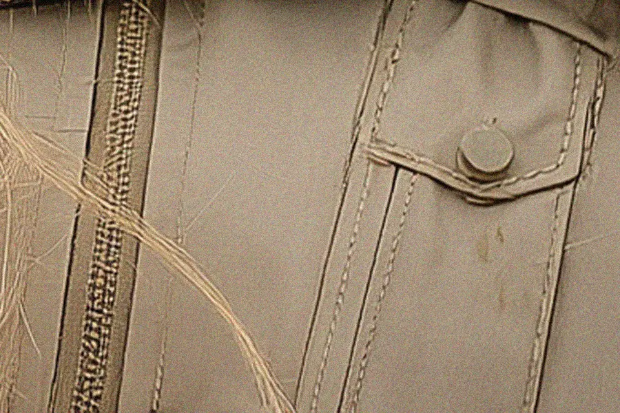 Zoomed-in detail of an AI-generated jacket showing unnatural stitching and pocket construction